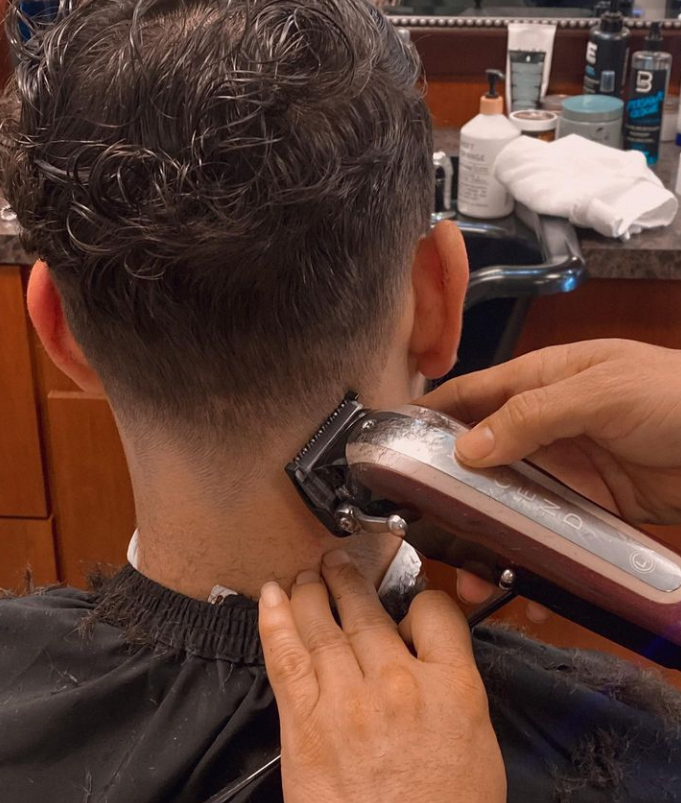 man with fade in barbers chair